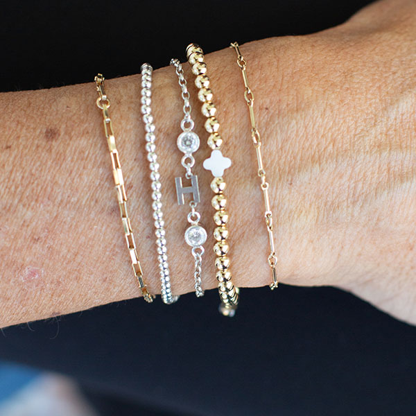 how to style permanent jewelry with mixed metals- mix sterling silver and 14k gold filled for the perfect combination of bracelets